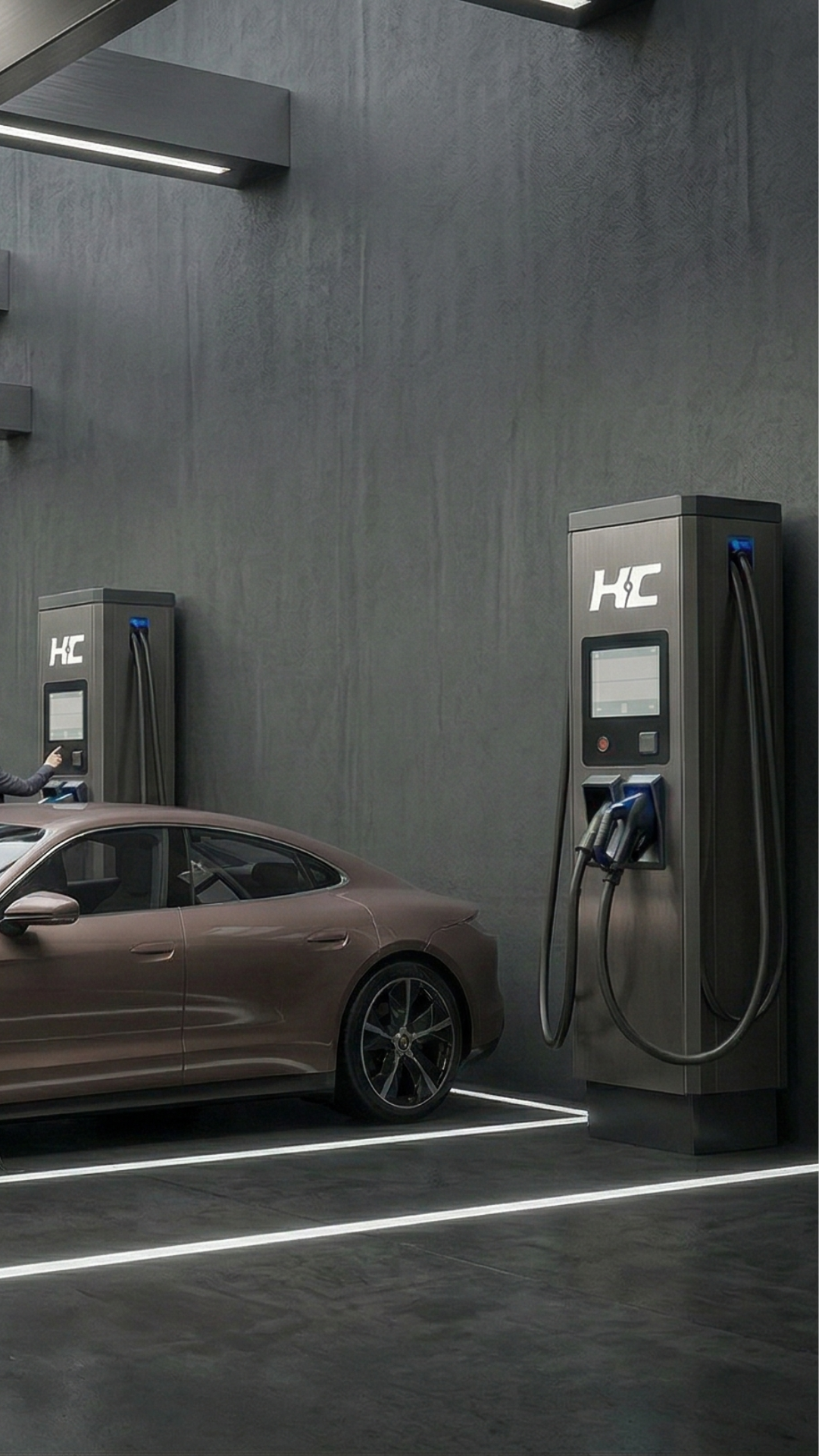 Electric car charging station man plugging cable