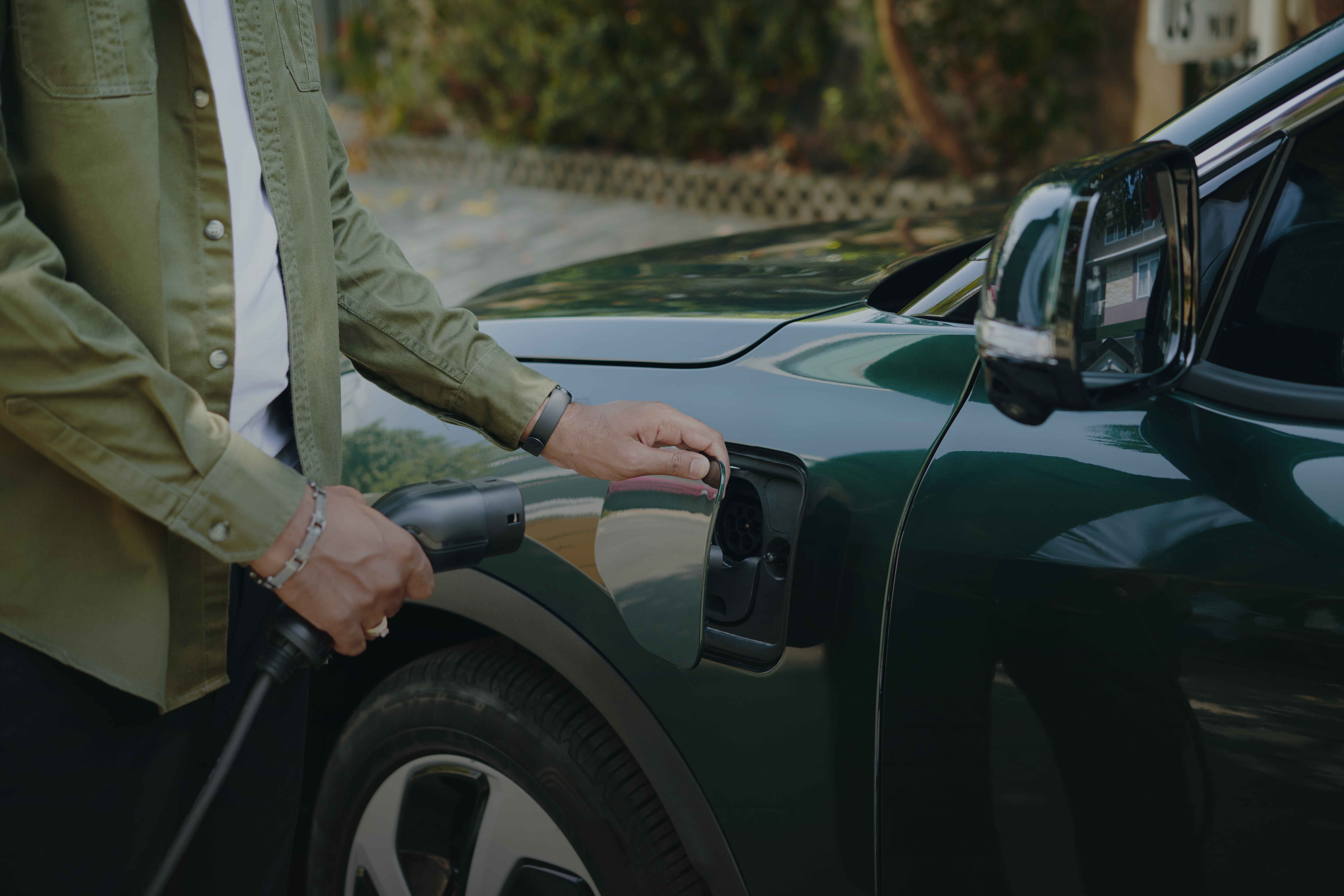 Electric vehicle charging at sunset station